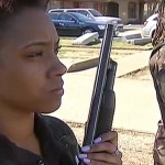 Members of the  New Black Panther Party stand guard.