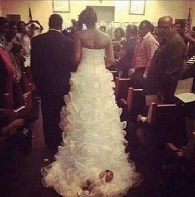 Bride ties newborn baby on her wedding dress gown, drags her down aisle.