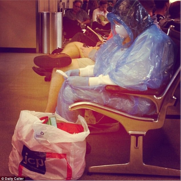 Female Passenger wears hazmut suit at Washington Dulles airport