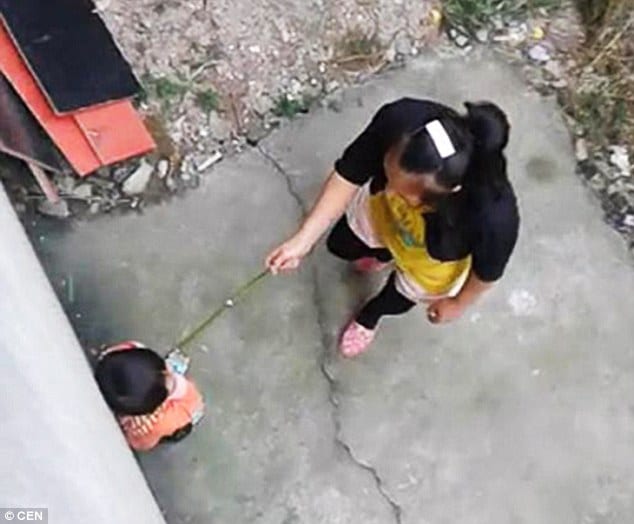 Video Chinese Stepmother Whips And Kicks Babe For Wetting Herself Cops Do Nothing