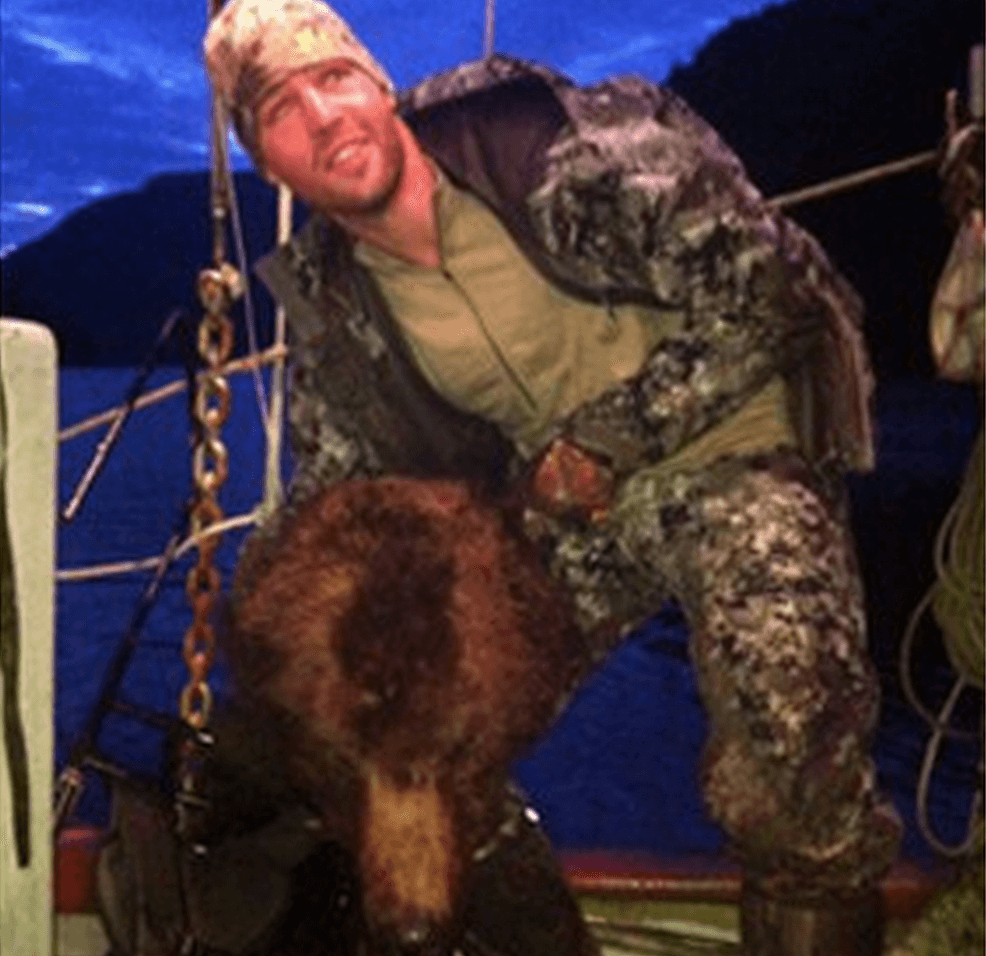 Clayton Stoner, NHL player posing dead bear’s head