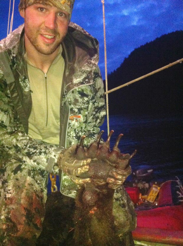 Clayton Stoner, NHL player posing dead bear’s head