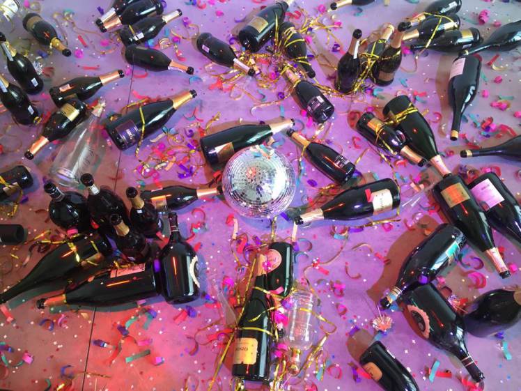 Italian art installation of empty champagne bottles thrown away