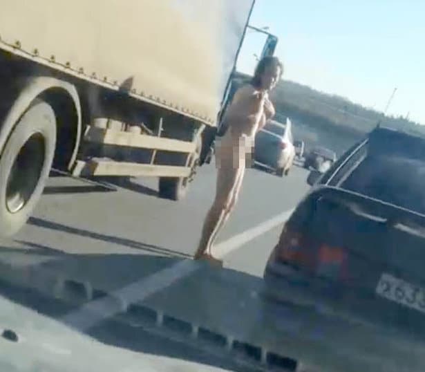 Naked Russian woman walks down Moscow motorway