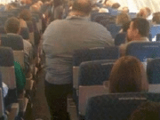passenger sues American Airlines after sitting next to two obese passengers 14 hours