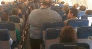 passenger sues American Airlines after sitting next to two obese passengers 14 hours
