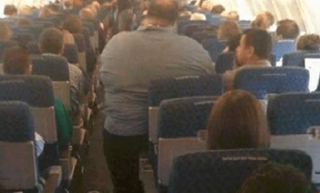 passenger sues American Airlines after sitting next to two obese passengers 14 hours