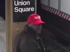Black man wearing Make America Great Again hat