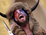 Horned Arizona QAnon conspiracy supporter leads capitol riots Jake Angeli QAnon Shaman Arizona Trump supporter