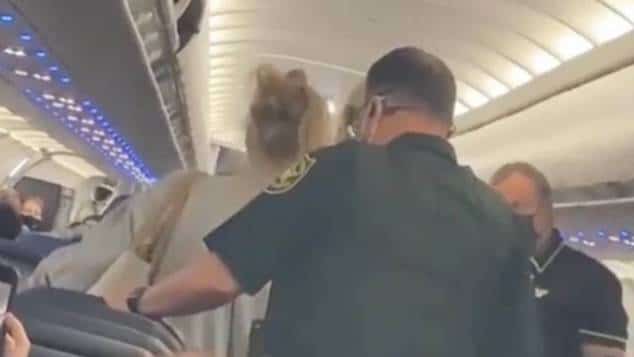 Spirit airlines female passenger lights cigarette on plane booted off