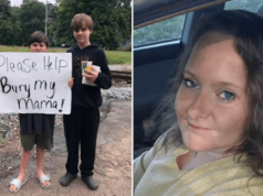 Kayden Ely Georgia 11 year old boy holds sign to pay for mother's funeral and burial costs.