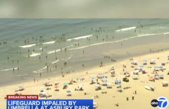 Female lifeguard impaled by 6ft beach umbrella at Jersey shore after falling of lifeguard chair at Asbury Park.