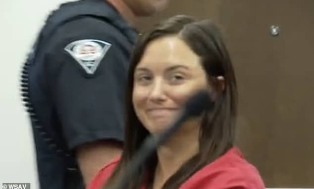Nicole Ballew Callaham former Anderson County teacher grins during Greenville county bond hearing